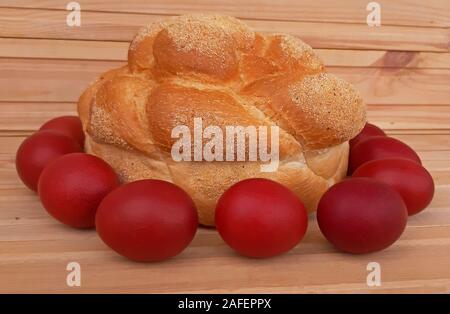 Easter red eggs and homemade bread. Easter concept Stock Photo