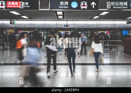 HongKong, China - November, 2019:  People using subway train at  MTR station / metro train station in HongKong Stock Photo