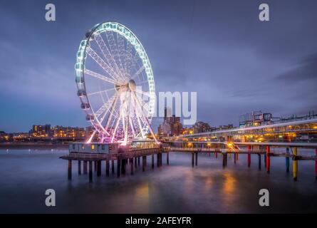 Long exposure image of the ferris wheel on the pier of Scheveningen, The Hague. Stock Photo
