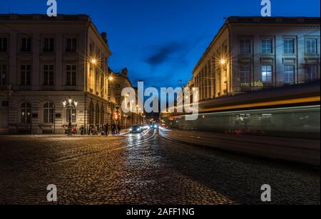 Brussels Old Town, Brussels Capital Region / Belgium - 11 30 2019: View over the Saint Jacques sur Coudenberg square with the light trails of a tramwa