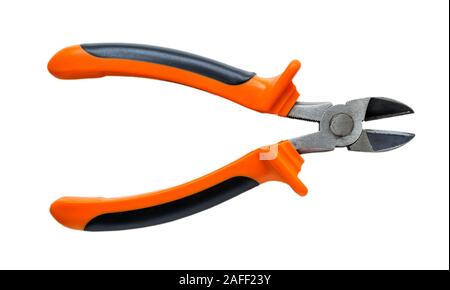 New wire cutters with orange black rubber handles isolated on white background. Electrician tool for repair and construction. Top view. Stock Photo