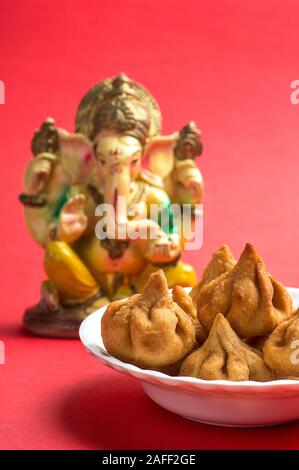Clay Modak Homemade Lord Ganesha idol for Ganesh Chaturthi Festival using ...