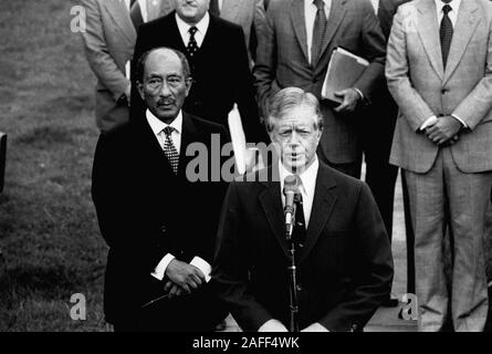 Washington DC, USA. 8th Apr, 1980. US President JIMMY CARTER, center, speaks from the south lawn after welcoming Egyptian President ANWAR SADAT, left, to the White House. Sadat and Carter spoke with both US and Egyptian officials during their meeting. Credit: Keystone Pictures USA/ZUMAPRESS.com/Alamy Live News Stock Photo