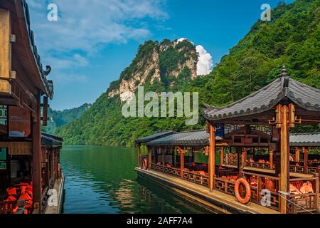 Wulingyuan, China -  August 2019 : Tourist boats waiting for passengers on the lakeshore of Baofeng Lake, Zhangjiajie National Forest Park, Hunan Prov Stock Photo