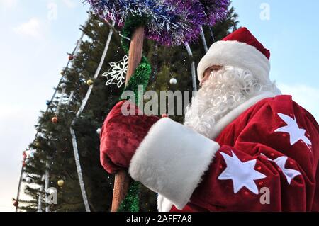 Cherkasy, Ukraine,December,24, 2011: Santa Claus  took part in New year show in the city square near the Christmas tree Stock Photo