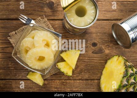 Preserved Pineapple Rings on a vintage background as detailed close-up shot, selective focus Stock Photo