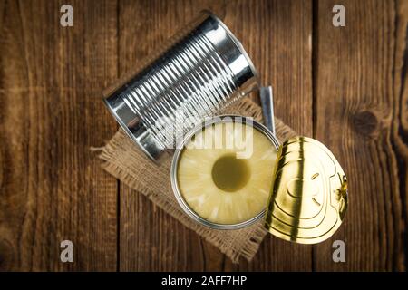 Fresh made Preserved Pineapple Rings on a vintage background as detailed close-up shot Stock Photo
