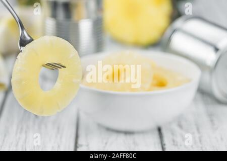 Preserved Pineapple Rings on a vintage background as detailed close-up shot, selective focus Stock Photo