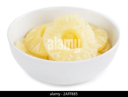 Portion of Preserved Pineapple Rings as detailed close-up shot isolated on white background Stock Photo