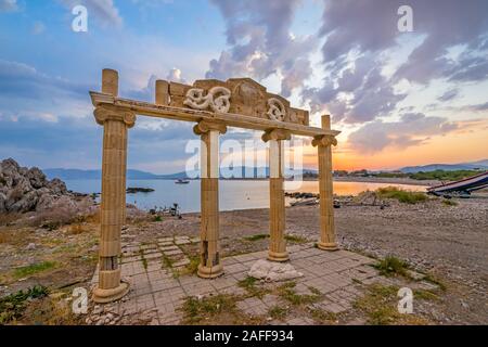 Sunset and Greek column ruins at Haraki Beach Charaki on the Island of Rhodes in the Dodecanese Greece Europe Stock Photo
