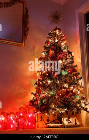 An artificial Christmas Tree in a living room Stock Photo
