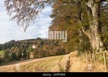 Cragievar Castle on a Sunny Morning in Autumn, Seen from the Edge of a Stubble Field Stock Photo