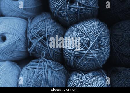 Skeins of wool in all shades of classic blue. Handmade concept. The color of the year 2020 is classic blue. Gradient color. Background made of blue sk Stock Photo