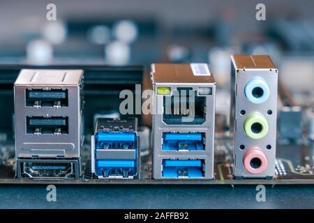 USB 2.0 and USB 3 socket ports on computer motherboard. PC components. Ethernet socket. Audio in and audio out socket on PC. Stock Photo