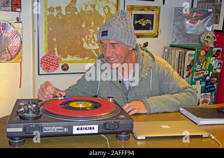 Owner,Lizard Inc Records,Independent Record Shop,Legh St, Warrington,Cheshire,England,UK, WA1 1UG,playing a single Stock Photo