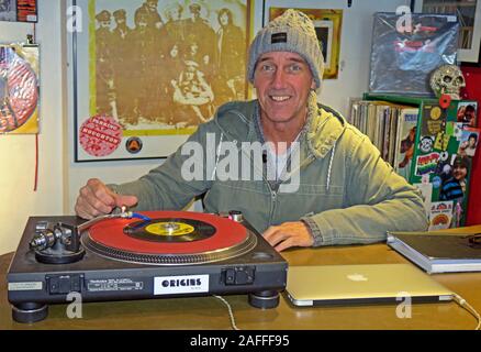 Owner,Lizard Inc Records,Independent Record Shop,Legh St, Warrington,Cheshire,England,UK, WA1 1UG,playing a single Stock Photo