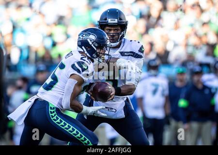 Seattle Seahawks running back Travis Homer (25) catches a pass while  warming up to play the