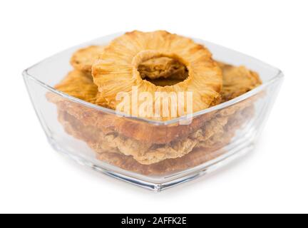 Portion of Dried Pineapple Rings as detailed close-up shot isolated on white background Stock Photo