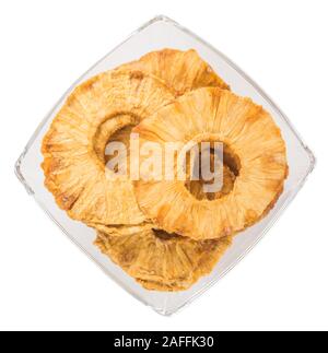 Fresh made Dried Pineapple Rings isolated on white background; close-up shot Stock Photo
