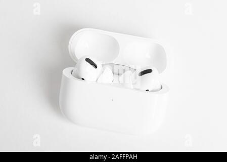 Vidalia, Georgia / USA - December 14, 2019 - A studio product shot of the Apple AirPods Pro buds nestled inside its open charging case set on a plain Stock Photo