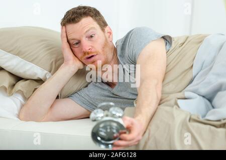 man having trouble waking up in the morning Stock Photo