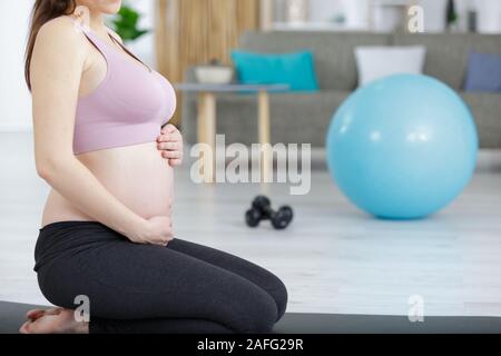 a pregnant woman during fitness Stock Photo