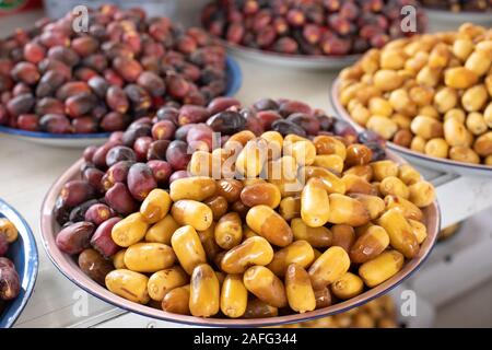 A pile of fresh organic dates ripe right after picking. Al Ain, Abu Dhabi, United Arab Emirates. Stock Photo