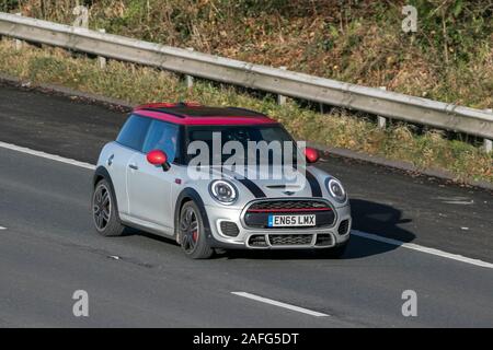 2015 silver Mini John Cooper Works Auto; driving on the M61 motorway near Manchester, UK Stock Photo