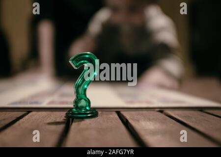 Green question mark symbol on a wooden board Stock Photo