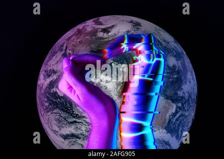 Heart shaped by the hands of a man and a robot against the background of the Earth. Future concept. Elements of this image are furnished by NASA Stock Photo