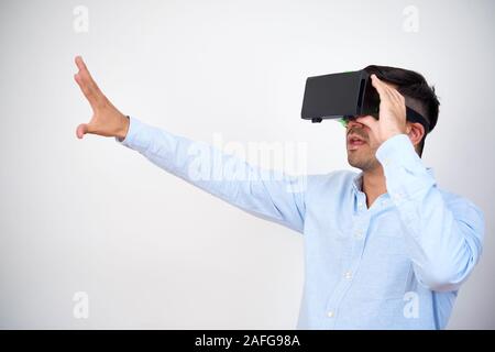 Businessman using virtual reality headset when working on presentation for ambitious project Stock Photo