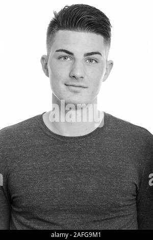 Face of young handsome man in black and white Stock Photo