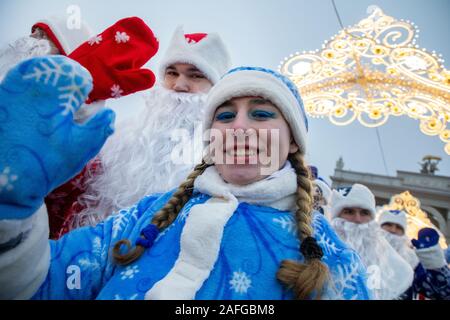 Moscow, Russia. 15th of December, 2019 People in Father Frost costumes with a wind band march during the Father Frosts Festival at VDNKh in Moscow, Russia Stock Photo