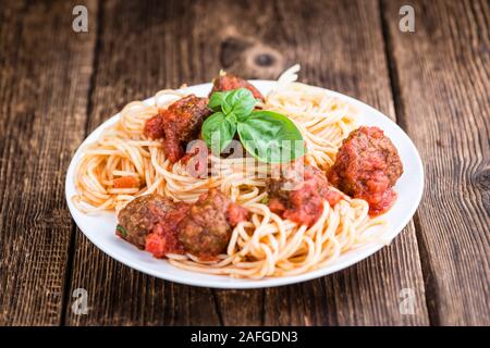 Pasta with Meatballs and Sauce (selective focus) on an old wooden table Stock Photo