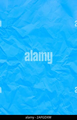 Blue crumpled wrinkled textured paper background. Copy space Stock Photo