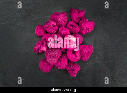 Dried Raspberries on a vintage slate slab as detailed close-up shot; selective focus Stock Photo