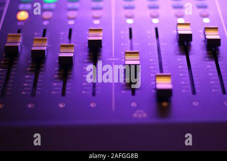 Closeup of a studio sound effect tools under neon lights with a blurry background Stock Photo