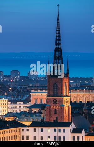 Stockholm, Sweden. Scenic View Of Stockholm Skyline At Summer Evening. Famous Popular Destination Scenic Place In Dusk Lights. Riddarholm Church In Ni Stock Photo