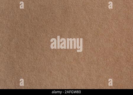 Background made of a closeup of brown paper. Can be used as texture in art projects. Stock Photo