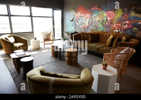 Lounge and casual meeting area in the office of a creative business, daytime, no people Stock Photo