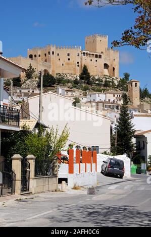 View of the castle on the hill with townhouses in the foreground, Velez Blanco, Almeria Province, Andalucia, Spain. Stock Photo