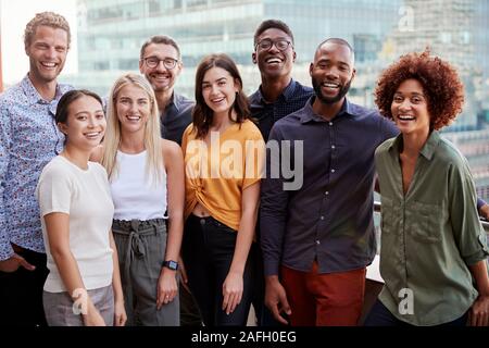 Group portrait of a creative business team standing outdoors, three quarter length, close up Stock Photo