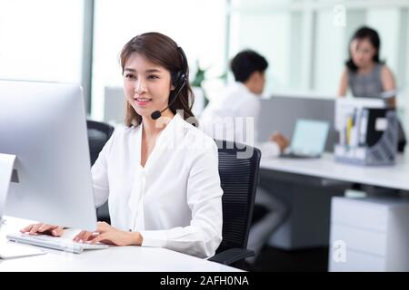 Young call center agents working in office Stock Photo