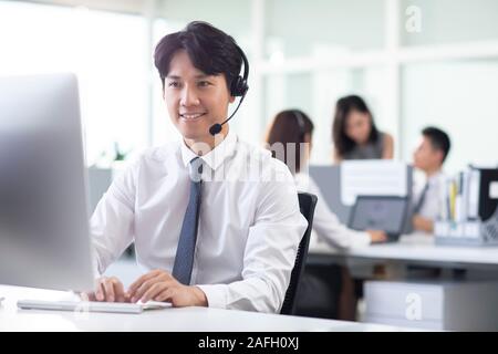 Call center agents working in office Stock Photo