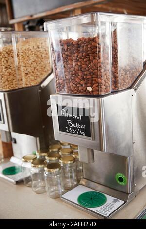 Dispensers For Almond Butter In Sustainable Plastic Free Grocery Store Stock Photo
