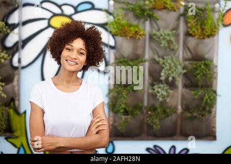 Outdoor Head And Shoulders Portrait Of Smiling Young Woman Stock Photo