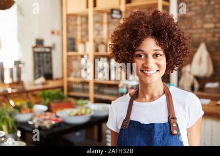 Portrait Of Female Owner Of Sustainable Plastic Free Grocery Store Stock Photo