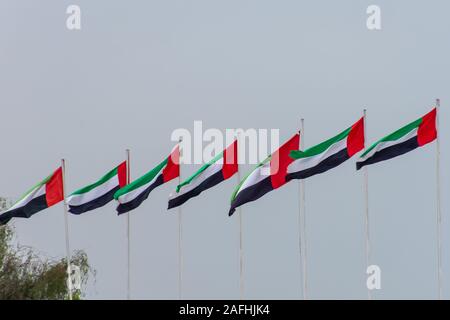 Ras al Khaimah flag (red and white) in the United Arab Emirates (UAE ...