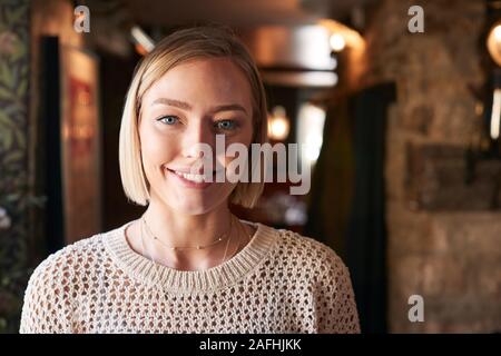 Portrait Of Female Receptionist Working  At Hotel Check In Stock Photo
