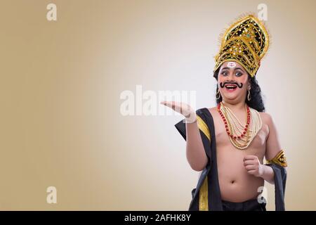 Ravan Hand ravan smiling with his hand in air Stock Photo - Alamy